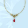 collier or 18 carats et grenat catalan style feuillages arabesque